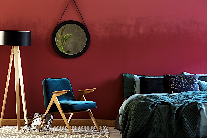 Maroon Walls with Green and Blue Furnishings