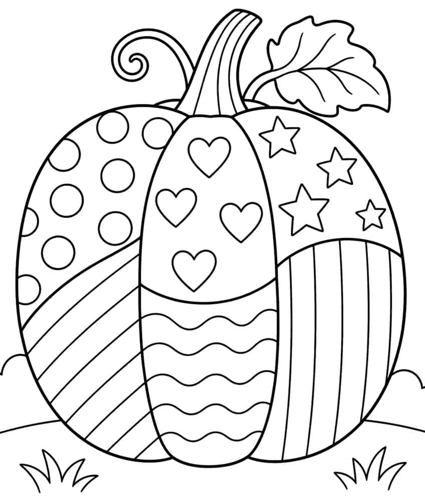Kürbis mit Patchwork-Mustern aus Punkten, Herzen, Sternen und Streifen, dazu Stiel, Ranke, Blatt und Grasbüschel